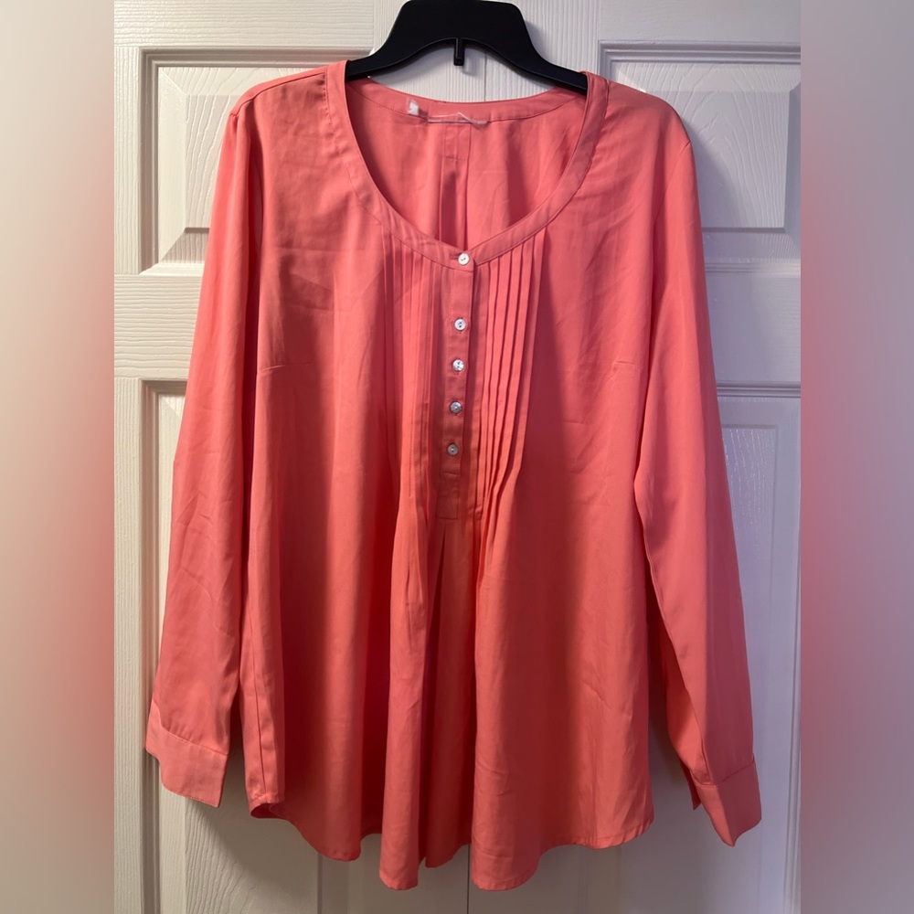 An exquisite pink blouse that's ideal for making a bold and stylish statement.